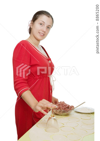 Woman making meat dumplings Woman making meat dumplings 8865200