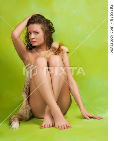 Naked girl covered with fur 8865292