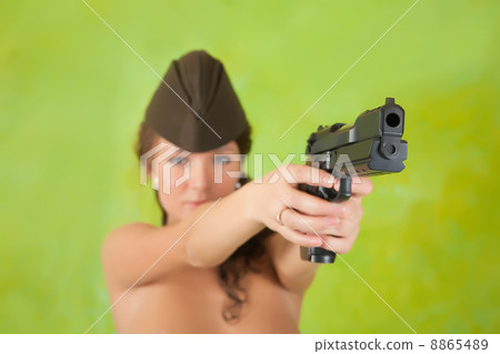 girl aiming a black gun 8865489
