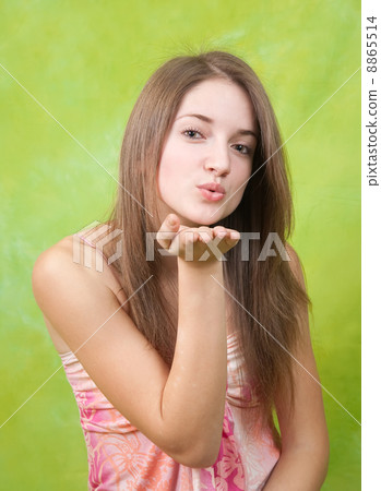 Air-kissing long-haired teen girl 8865514