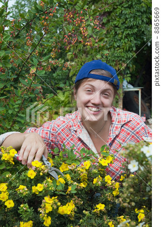 Girl cutting prairieweed 8865669
