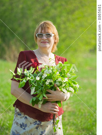 senior woman in spring garden 8865681