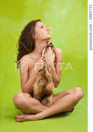 woman covered with a fox fur 8865731