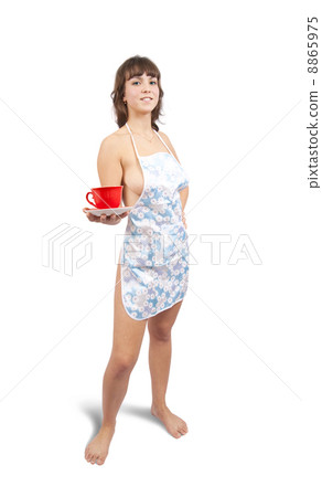 girl in bib overalls with tea cup 8865975