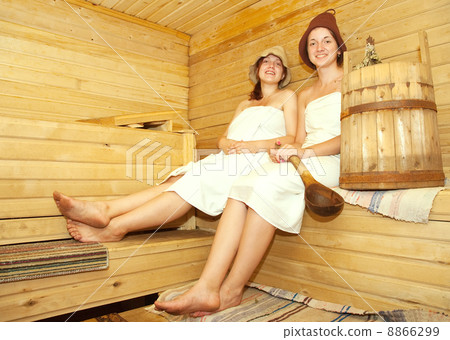 girls on bench in sauna girls on bench in sauna 8866299