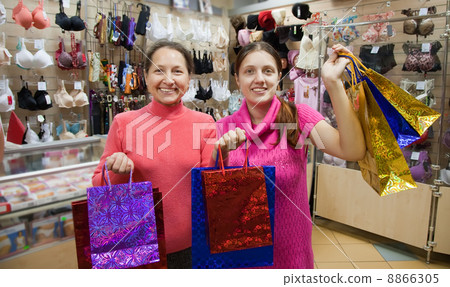 women with shopping bags in underwear shop women with shopping bags in underwear shop 8866305