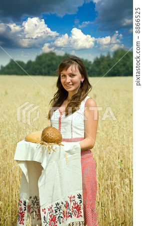 Girl with bread at field 8866525