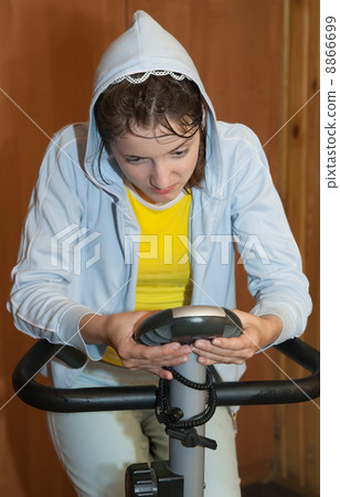 girl on exercycle 8866699