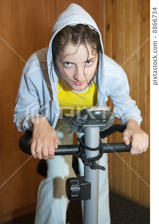 weariness girl on exercycle weariness girl on exercycle 8866734