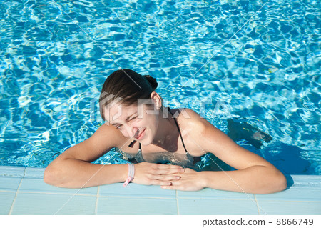 Girl in resort swimming pool Girl in resort swimming pool 8866749