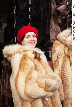 Woman chooses fur coat Woman chooses fur coat 8866751