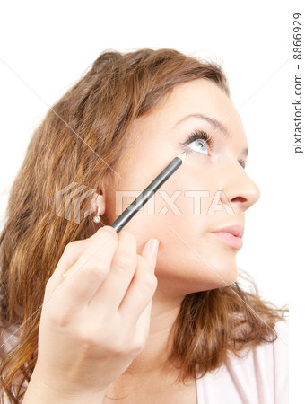 The girl puts mascara on with pen 8866929