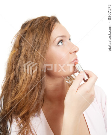 girl applying lipstick over white girl applying lipstick over white 8867175