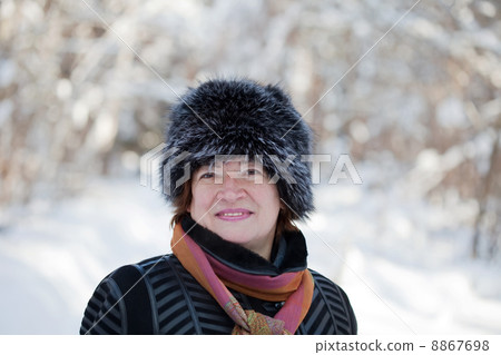 mature woman in wintry forest 8867698