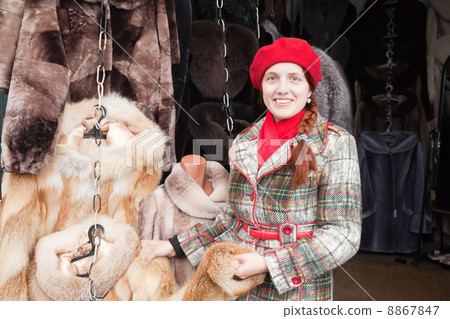Woman chooses fur coat Woman chooses fur coat 8867847