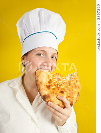 baker is eating fresh loaf 8867899