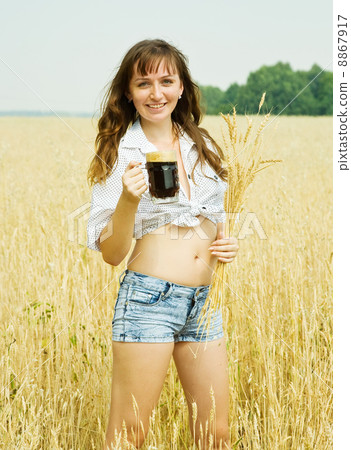 Girl with beer at field 8867917