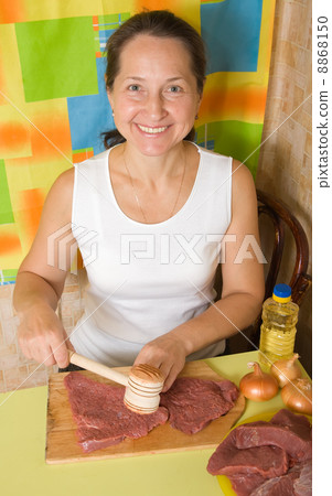 woman making tenderized steak woman making tenderized steak 8868150