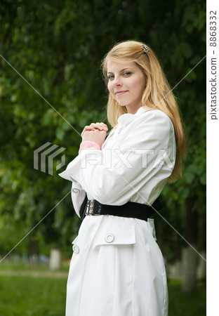 girl in cloak against park 8868332