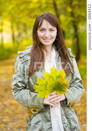 girl in autumn park 8868412