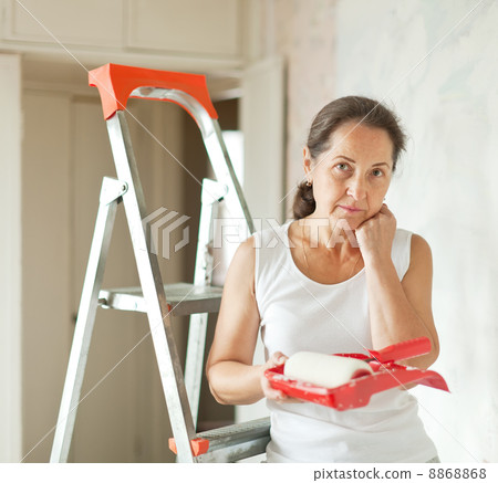 woman makes repairs at home 8868868