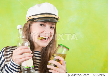 female sailor with bottle of vodka and pickle 8868997