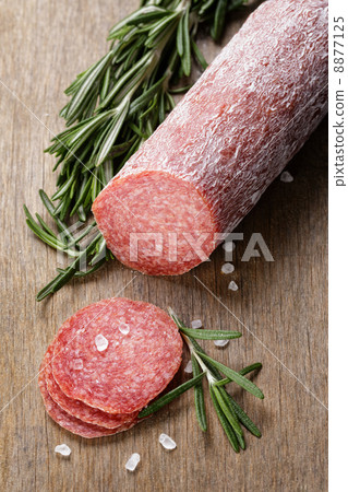 italian salami sausage slices with rosemary and sea salt italian salami sausage slices with rosemary and sea salt 8877125