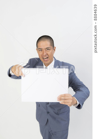 A man pointing to a sketchbook 8884639