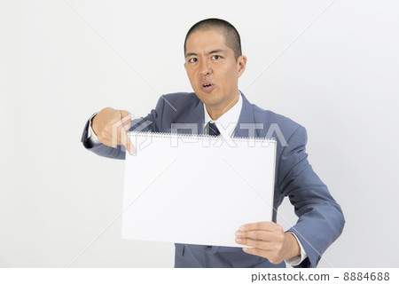 A man pointing to a sketchbook A man pointing to a sketchbook 8884688