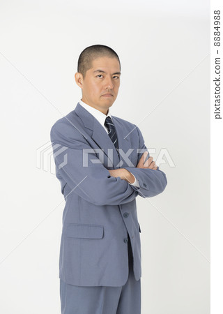 Men in a suit wearing arms 8884988