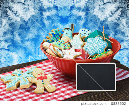 Christmas gingerbread cookies and a blackboard with congratulati 8888602