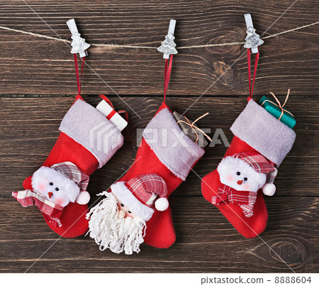 Christmas socks with gifts hanging Christmas socks with gifts hanging 8888604