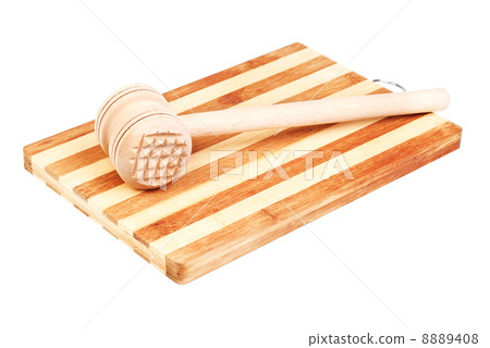 a wooden hammer for beating the meat 8889408