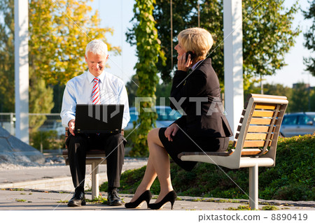 Business people working outdoors Business people working outdoors 8890419