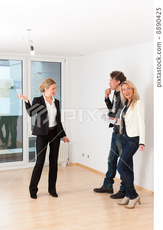 Young couple looking for real estate with female realtor Young couple looking for real estate with female realtor 8890425