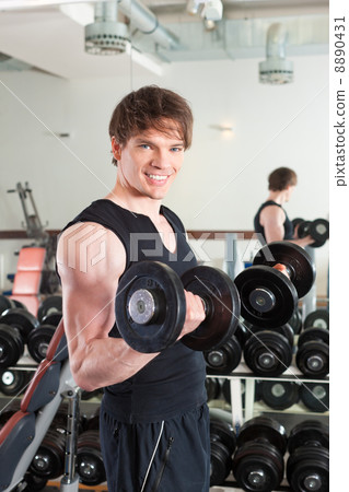 Sport - man is exercising with barbell in gym Sport - man is exercising with barbell in gym 8890431