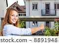 Young woman showing her first home 8891948