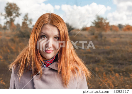 carrot-top women smiling at fall 8892317