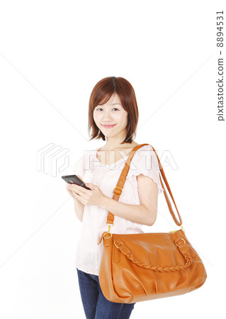 A woman in a shoulder bag A woman in a shoulder bag 8894531