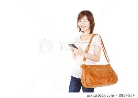 A woman in a shoulder bag A woman in a shoulder bag 8894534