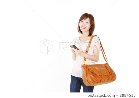 A woman in a shoulder bag A woman in a shoulder bag 8894535