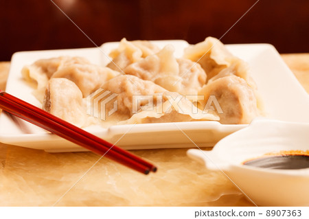 Jiaozi - Chinese dumplings filled with pork and spring onions. 8907363