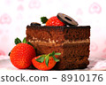 Slice of chocolate cake with strawberries 8910176