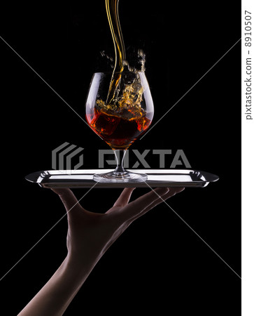 Cognac or brandy on a black 8910507