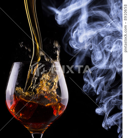 Cognac glass shrouded in a smoke Cognac glass shrouded in a smoke 8910658