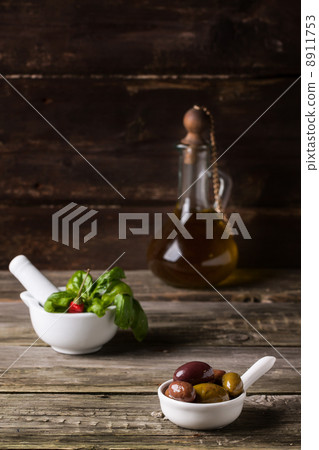 Olive oil with olives and basil Olive oil with olives and basil 8911753