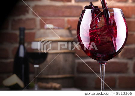 Glass of wine against a brick wall Glass of wine against a brick wall 8913306