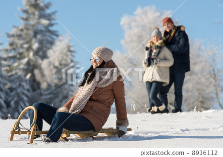 Friends enjoy sunny winter day on sledge Friends enjoy sunny winter day on sledge 8916112