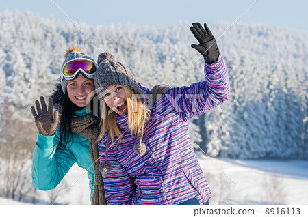 Two female friends winter snow in mountains Two female friends winter snow in mountains 8916113