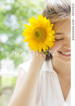A woman with sunflower A woman with sunflower 8916925